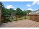 View of a wooden deck overlooking lush green backyard at 5126 Wellsley Bnd, Alpharetta, GA 30005