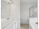 Bright bathroom featuring a large vanity with a framed mirror and a glass-enclosed shower at 5126 Wellsley Bnd, Alpharetta, GA 30005