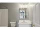 Bathroom featuring white vanity, updated fixtures and a shower at 5126 Wellsley Bnd, Alpharetta, GA 30005