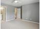 Bedroom with carpet, neutral walls, and access to an ensuite bathroom at 5126 Wellsley Bnd, Alpharetta, GA 30005
