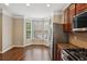 Eat-in kitchen with bay window and stainless steel appliances at 5126 Wellsley Bnd, Alpharetta, GA 30005