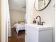 Bathroom with white vanity and view into adjacent bedroom at 863 Needle Rock Dr, Stonecrest, GA 30083