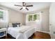 Bedroom with a ceiling fan, hardwood floors, and bright windows at 863 Needle Rock Dr, Stonecrest, GA 30083