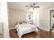 Bedroom with hardwood floors, a ceiling fan, and bright windows at 863 Needle Rock Dr, Stonecrest, GA 30083
