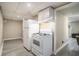 Basement kitchen area features a white refrigerator and range with upper cabinets at 863 Needle Rock Dr, Stonecrest, GA 30083