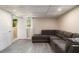 Basement living room with access to a bathroom and door to the exterior at 863 Needle Rock Dr, Stonecrest, GA 30083
