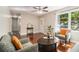 Inviting living room with hardwood floors, natural light, and stylish furnishings at 863 Needle Rock Dr, Stonecrest, GA 30083
