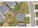 Aerial view of fenced backyard, patio, playground, and landscaping at 306 Coppergate Ct, Holly Springs, GA 30115