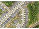 Aerial view showcasing a residential neighborhood layout and landscaping at 306 Coppergate Ct, Holly Springs, GA 30115