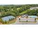 Aerial view of community amenities including a pool and tennis courts at 306 Coppergate Ct, Holly Springs, GA 30115