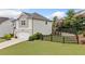 Two-story home with a well-maintained lawn and manicured landscaping at 306 Coppergate Ct, Holly Springs, GA 30115