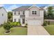 Beautiful two-story home boasts a well-manicured lawn, inviting entrance, and neutral color scheme at 306 Coppergate Ct, Holly Springs, GA 30115