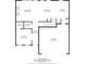 Detailed floor plan showcasing the layout of the first floor, including the kitchen, living room, and garage at 306 Coppergate Ct, Holly Springs, GA 30115