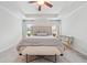 Beautiful main bedroom featuring tray ceilings, neutral colors and plush carpet at 306 Coppergate Ct, Holly Springs, GA 30115