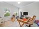Bright home office with hardwood floors, natural light and neutral paint at 306 Coppergate Ct, Holly Springs, GA 30115
