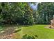 Secluded backyard with mature trees offers a private and peaceful retreat at 3878 Brookside Pkwy, Decatur, GA 30034