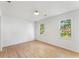 Comfortable bedroom featuring wood-look floors, neutral walls, and natural light through large windows at 3878 Brookside Pkwy, Decatur, GA 30034
