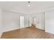 This spacious bedroom boasts wood-look floors, pristine white walls, and doorways to other rooms of the home at 3878 Brookside Pkwy, Decatur, GA 30034