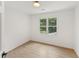 Clean bedroom with wood-look floors, neutral walls, and natural light from a window at 3878 Brookside Pkwy, Decatur, GA 30034