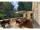 Inviting deck with outdoor dining set and grill, perfect for enjoying meals at 3878 Brookside Pkwy, Decatur, GA 30034