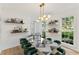 Dining room with a modern light fixture and bold, decorative table and chairs at 3878 Brookside Pkwy, Decatur, GA 30034