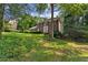 Traditional red brick home with lush lawn, landscaping, and mature trees at 3878 Brookside Pkwy, Decatur, GA 30034