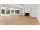 Large and open living room featuring beautiful fireplace and large windows offering natural light at 3878 Brookside Pkwy, Decatur, GA 30034