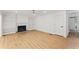 Bright living room with hardwood floors, fireplace, and built-in bookshelves at 3878 Brookside Pkwy, Decatur, GA 30034