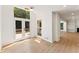 Bright living room with hardwood floors and access to outdoor deck via glass doors at 3878 Brookside Pkwy, Decatur, GA 30034