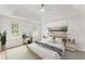 Serene main bedroom with large windows, tray ceiling, and stylish decor at 3878 Brookside Pkwy, Decatur, GA 30034