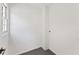 Bright empty room with window, neutral walls, and neutral flooring at 3878 Brookside Pkwy, Decatur, GA 30034