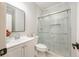 Bathroom boasts a glass-enclosed shower, sleek vanity, and modern fixtures at 5635 Upper Creek Ct, Suwanee, GA 30024
