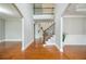 Inviting foyer with hardwood floors, staircase, and decorative trim at 5635 Upper Creek Ct, Suwanee, GA 30024