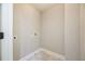 Laundry room features tiled floors, neutral paint, and washer hookups at 5635 Upper Creek Ct, Suwanee, GA 30024