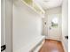 Mudroom features built-in bench, storage, and convenient access to the outside at 5635 Upper Creek Ct, Suwanee, GA 30024
