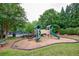 Community playground offers hours of outdoor fun with slides and climbing structures for neighborhood children and families at 5635 Upper Creek Ct, Suwanee, GA 30024