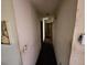 Long hallway with neutral walls leading to multiple rooms, offering potential for customization at 6255 Mozart Dr, Riverdale, GA 30296