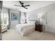 Inviting bedroom featuring bright windows, soft carpet and a contemporary ceiling fan at 4010 Cameron Ct, Cumming, GA 30040