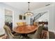 Formal dining room features a dark wood table and chairs, a statement chandelier, and access to the foyer at 4010 Cameron Ct, Cumming, GA 30040