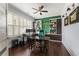Well-lit home office with built-in bookcases, plantation shutters, and hardwood floors at 4010 Cameron Ct, Cumming, GA 30040