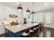 Modern kitchen with granite countertops, stainless steel appliances, and a breakfast bar at 4010 Cameron Ct, Cumming, GA 30040