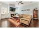 This living room offers a fireplace, built-in cabinets, and hardwood floors at 4010 Cameron Ct, Cumming, GA 30040