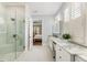 Spa-like bathroom with a glass shower, marble counters, and ample vanity space at 4010 Cameron Ct, Cumming, GA 30040