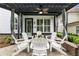 Charming patio with comfortable white seating and a stylish pergola at 4010 Cameron Ct, Cumming, GA 30040
