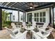 Inviting patio with a stylish pergola and comfortable outdoor seating at 4010 Cameron Ct, Cumming, GA 30040