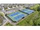 Aerial view of community tennis courts, showcasing the well-maintained sports facilities at 4010 Cameron Ct, Cumming, GA 30040