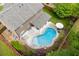The backyard includes an in-ground pool, covered patio, garden and beautiful landscaping at 470 Wagon Hill Ln, Sugar Hill, GA 30518