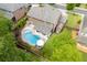 An aerial shot of the property, showcasing the pool, patio, garden, and spacious backyard at 470 Wagon Hill Ln, Sugar Hill, GA 30518