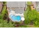 Aerial view of the backyard pool, patio, mature trees, and garden in a private setting at 470 Wagon Hill Ln, Sugar Hill, GA 30518