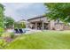 Spacious backyard featuring a pool, patio area, well-manicured lawn, and a shed for storage at 470 Wagon Hill Ln, Sugar Hill, GA 30518